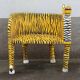 Wooden armchair with a "tiger" appearance.