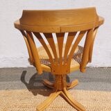 swivel armchair in wood and cane