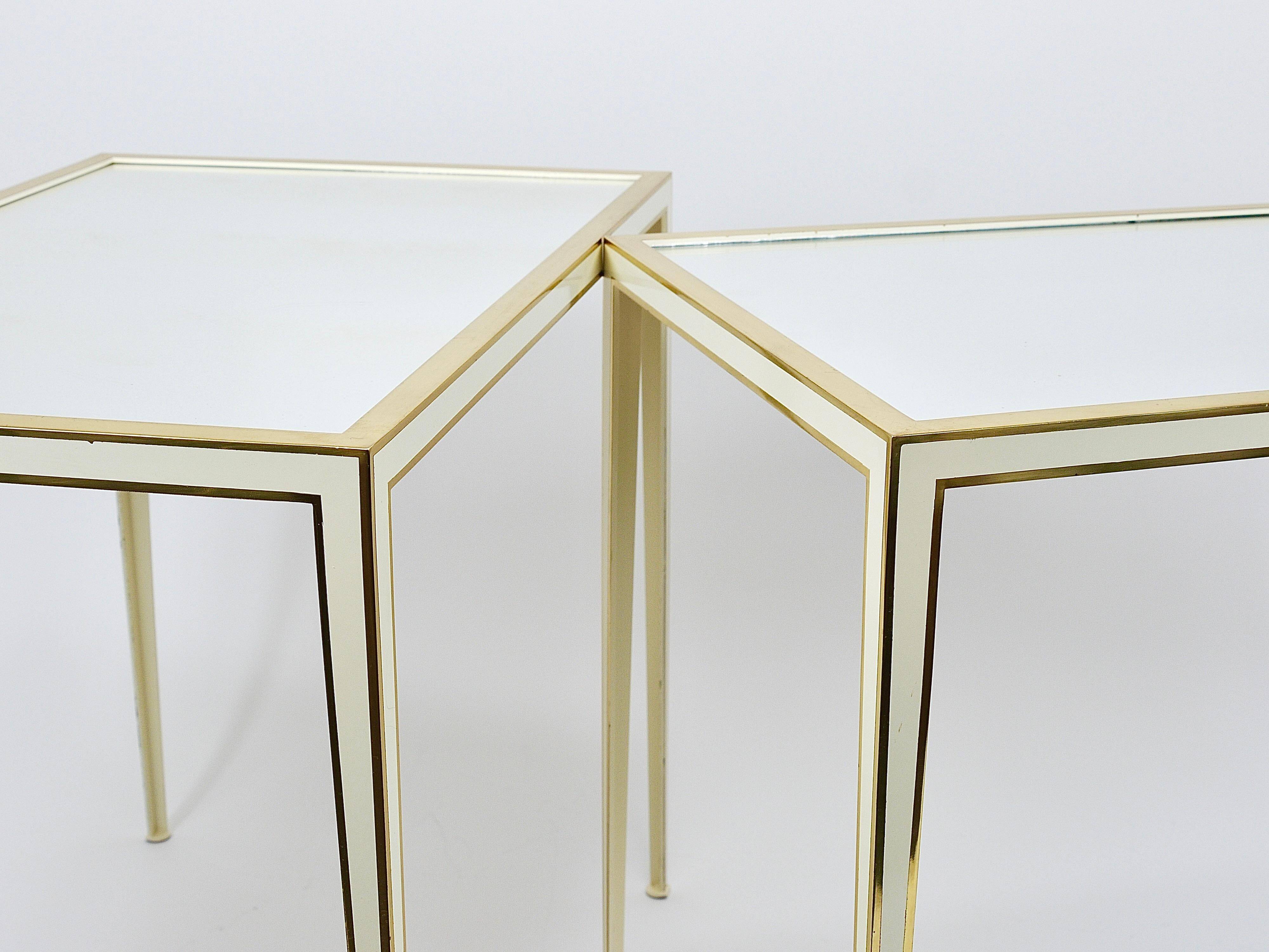 A pair of brass and white mirror tables from Vereinigte Werkstätten, Germany, 1970s.
