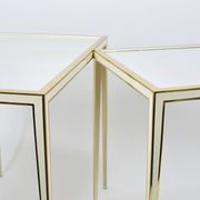 A pair of brass and white mirror tables from Vereinigte Werkstätten, Germany, 1970s.