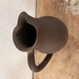 Ancient pitcher in earth