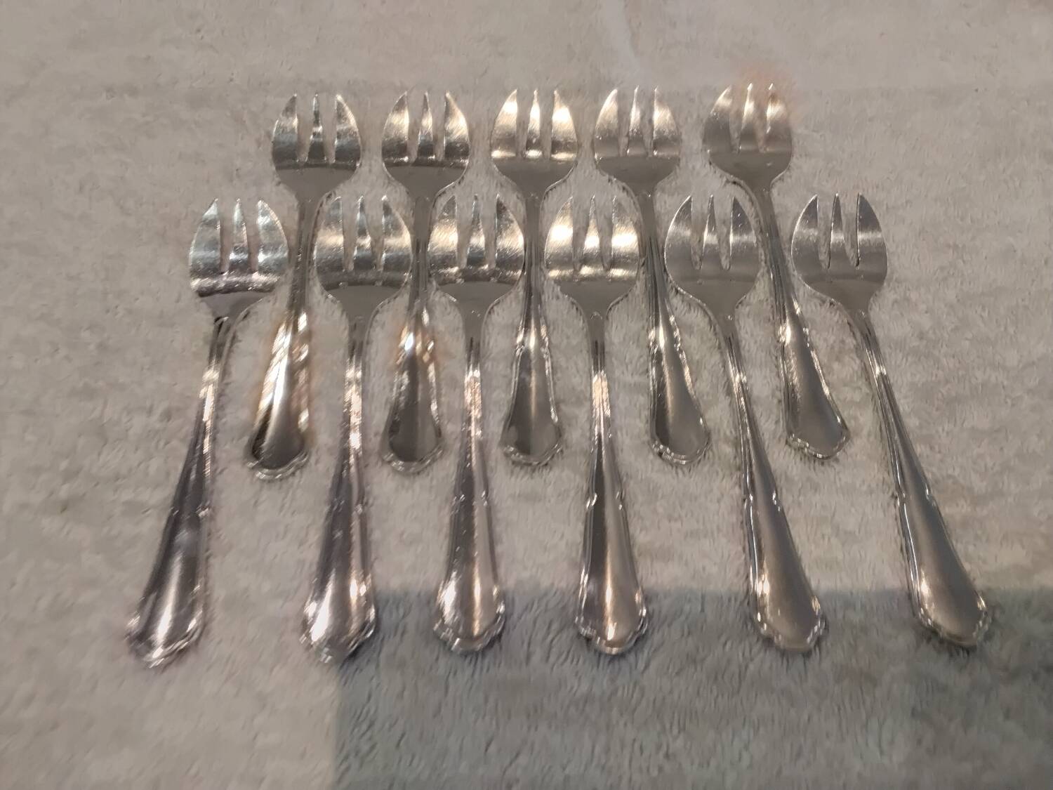 11 silver-plated oyster forks by Orbrille, 13.2cm