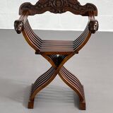 Vintage carved wooden folding armchair