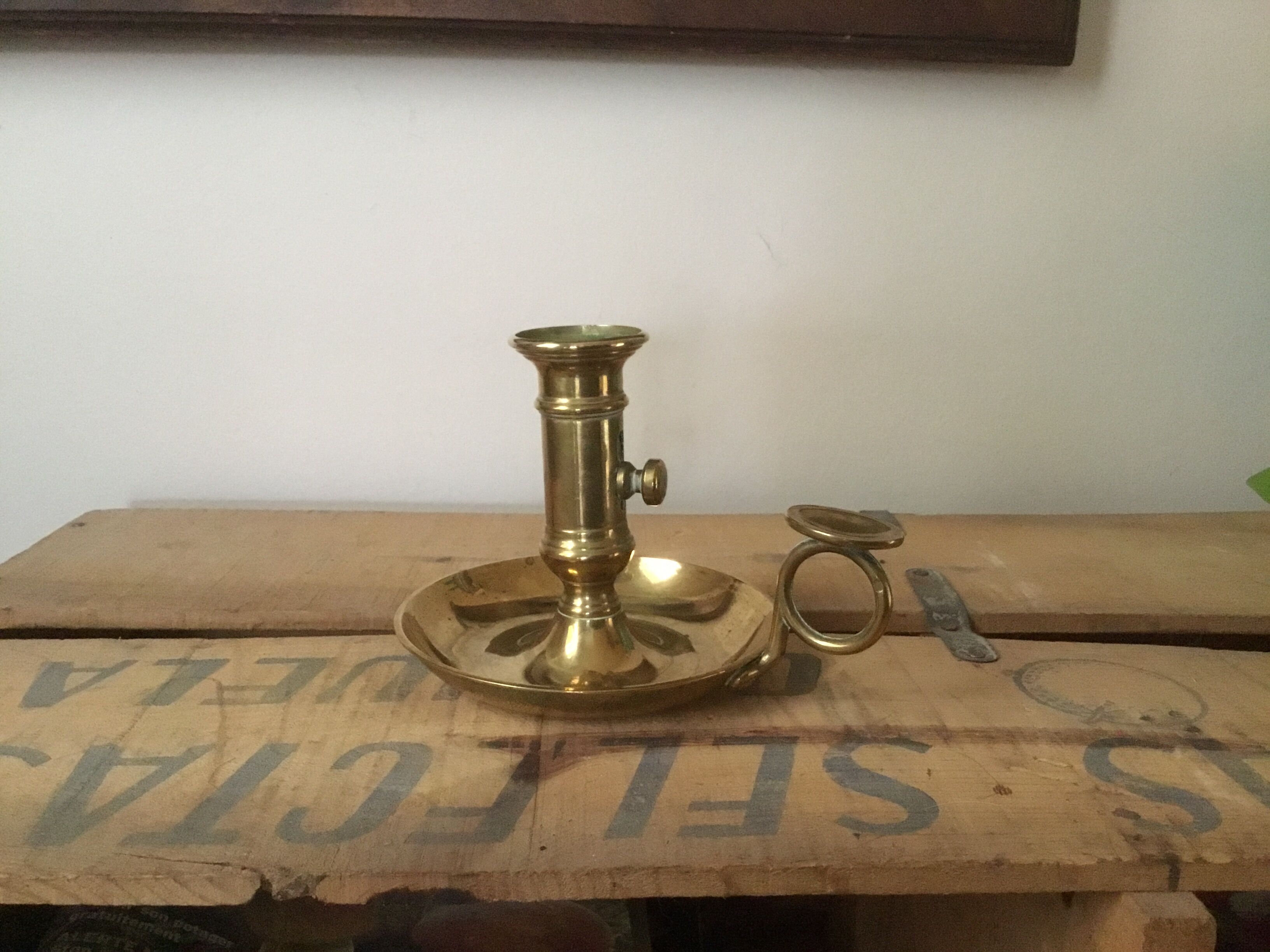 Thumb brass candlestick