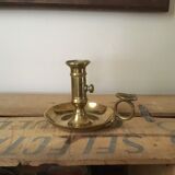 Thumb brass candlestick
