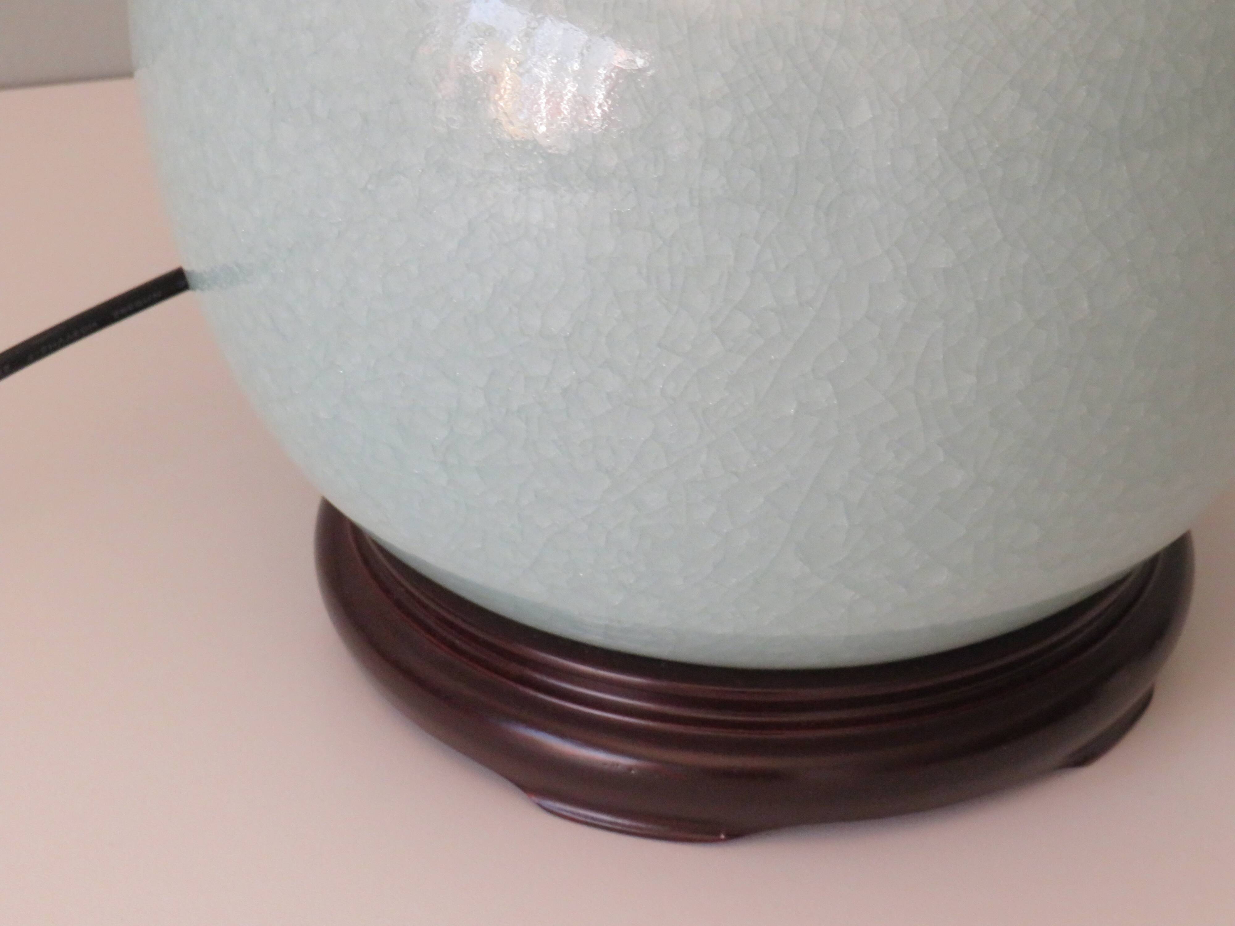Celadon-colored cracked ceramic table lamp with new personalized lampshade.