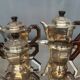 Art Deco tea and coffee service. Silver-plated metal and mahogany.