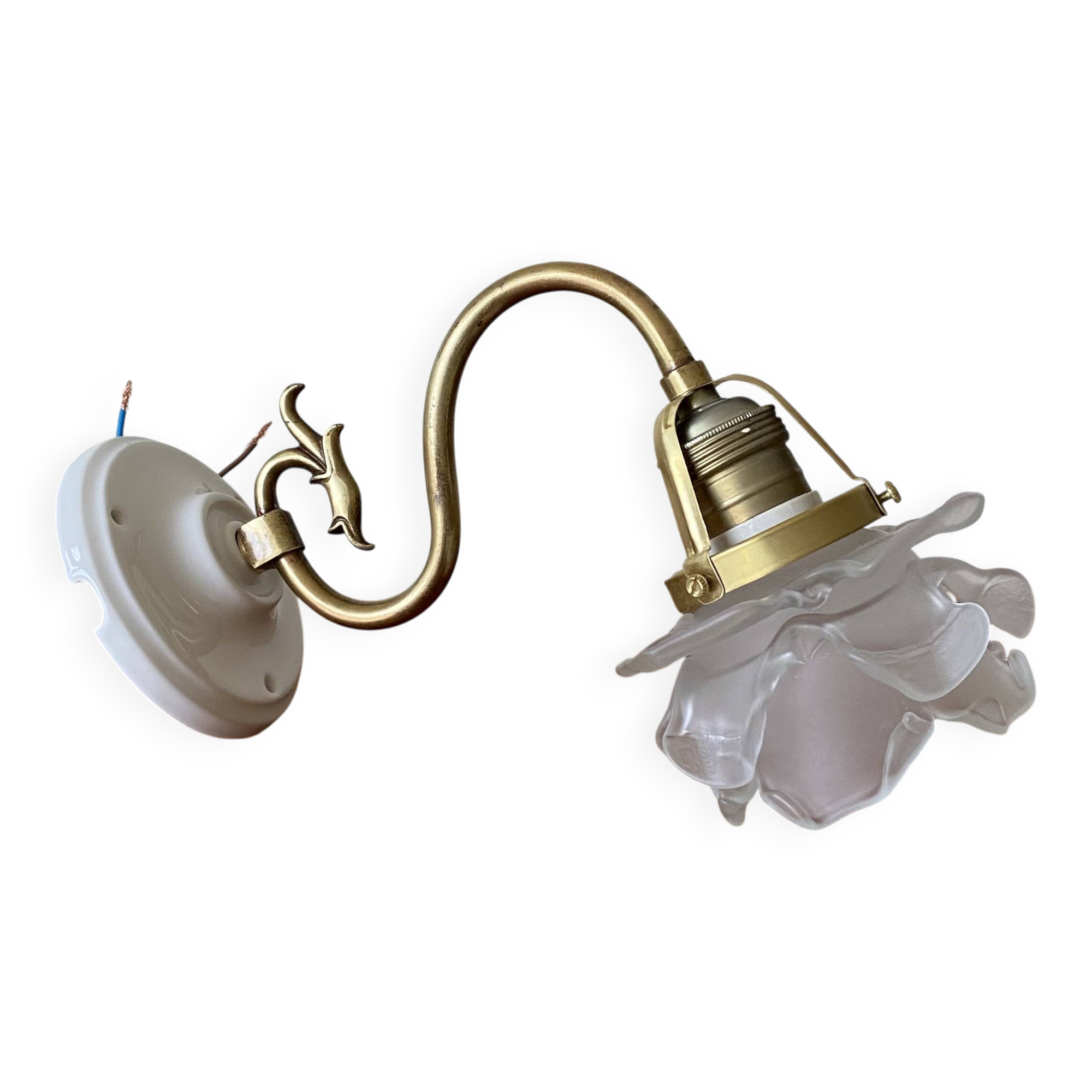 Swan neck wall light in brass with rose petal glass shade.
