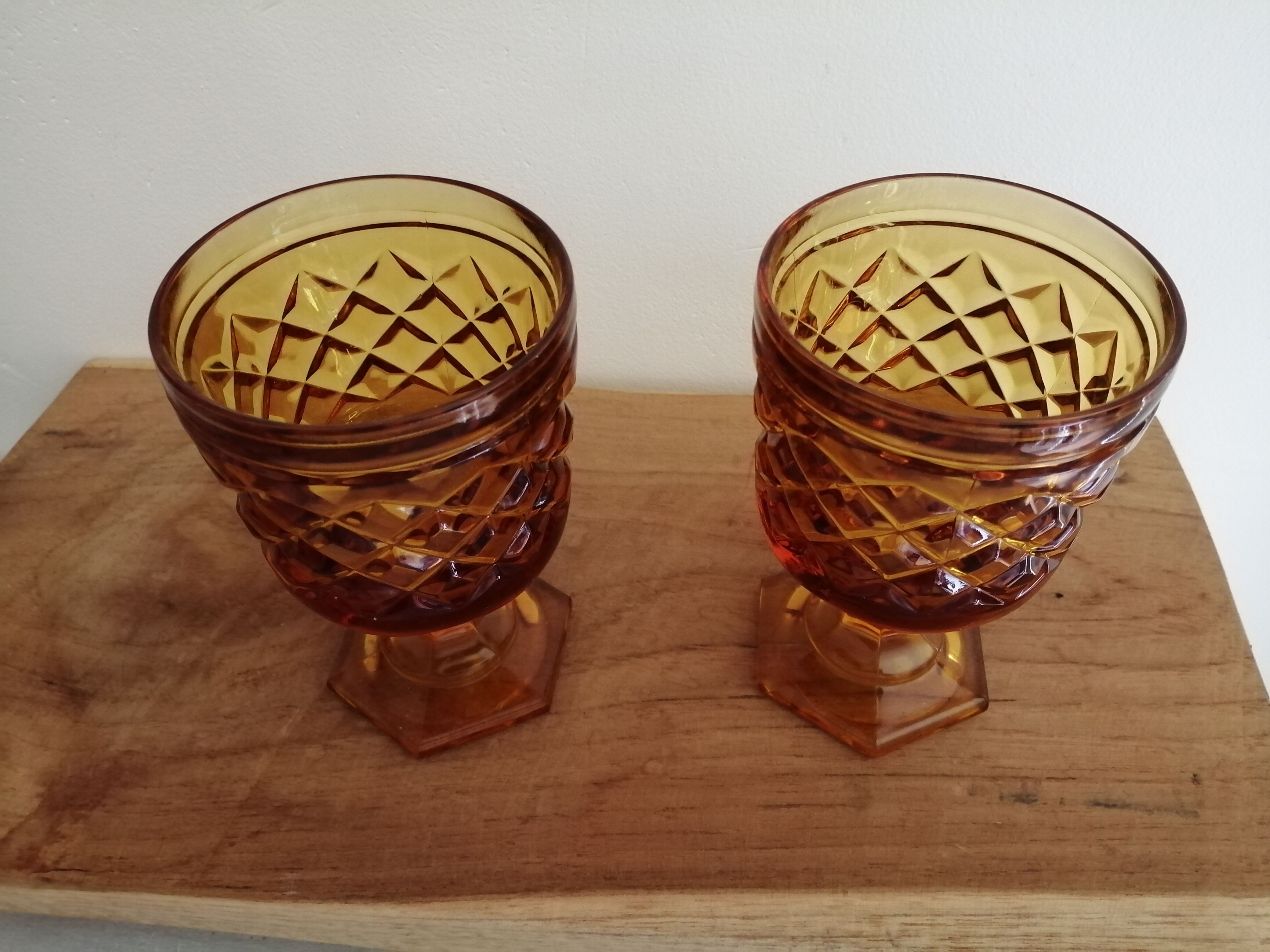 2 vintage amber walking glasses