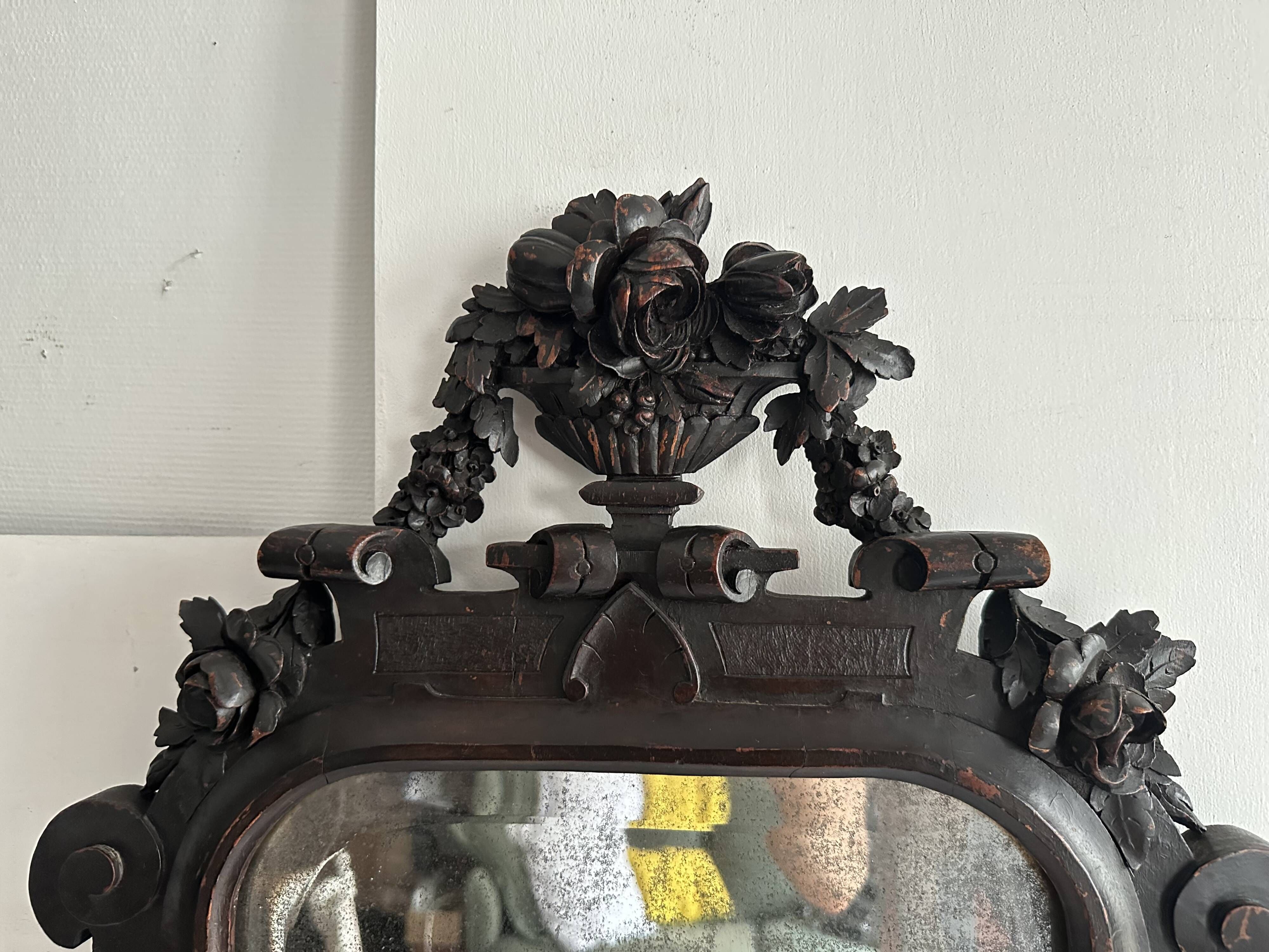 Napoleon III mirror in carved blackened wood, 19th century