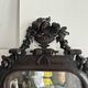 Napoleon III mirror in carved blackened wood, 19th century