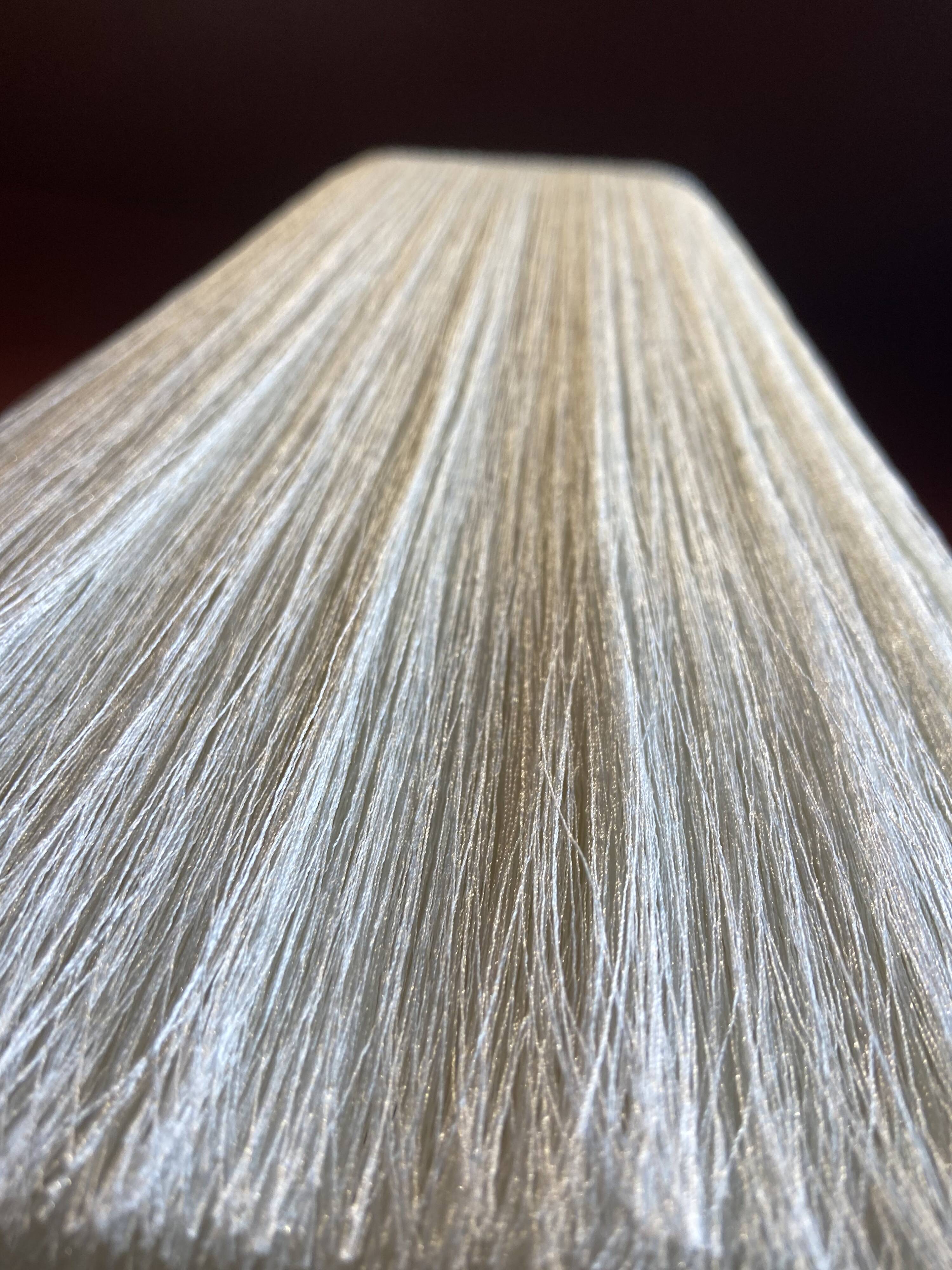 Beige marble stucco base, Houles white ecru fringed lampshade.