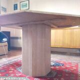 Octagonal dining table in travertine