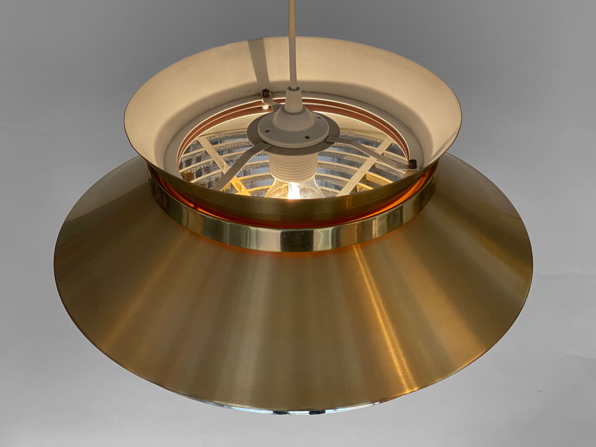 Brass colored aluminium pendant light by Carl Thore for Granhaga Metall. Sweden 1970s.