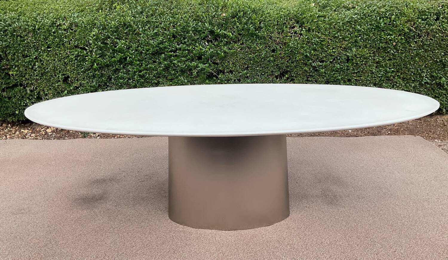 Oval designer dining table in frosted glass and brushed stainless steel