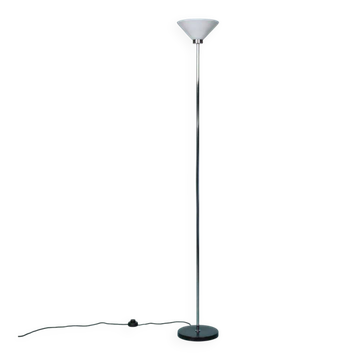Vintage floor lamp in milky glass and chrome, minimalist uplight lighting.