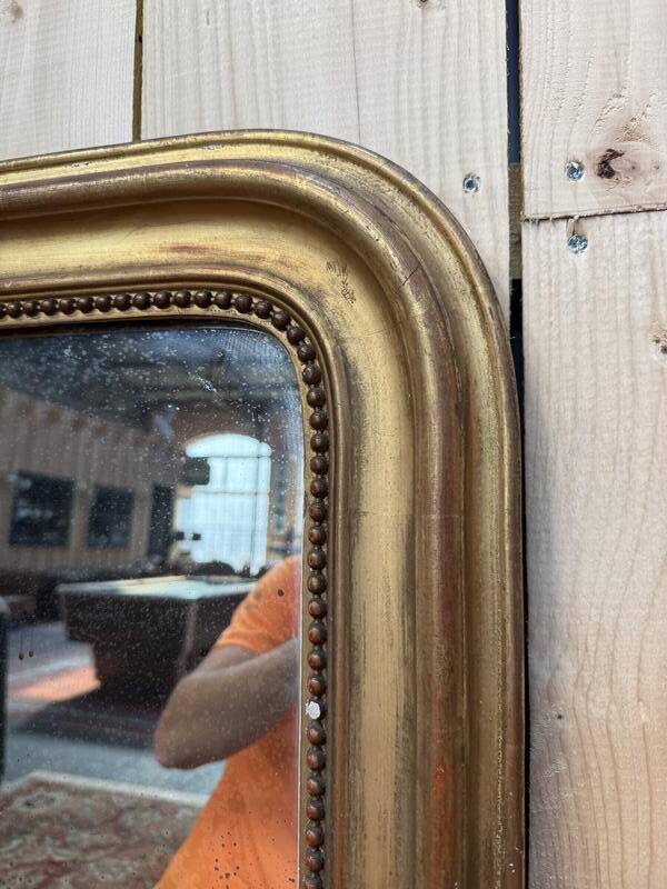 Miroir époque Louis Philippe à la feuille d'or.