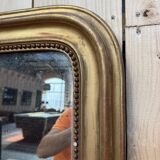 Miroir époque Louis Philippe à la feuille d'or.