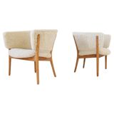Mid-century lounge chairs in sheepskin/shearling and stained wood, Sweden, 1962.