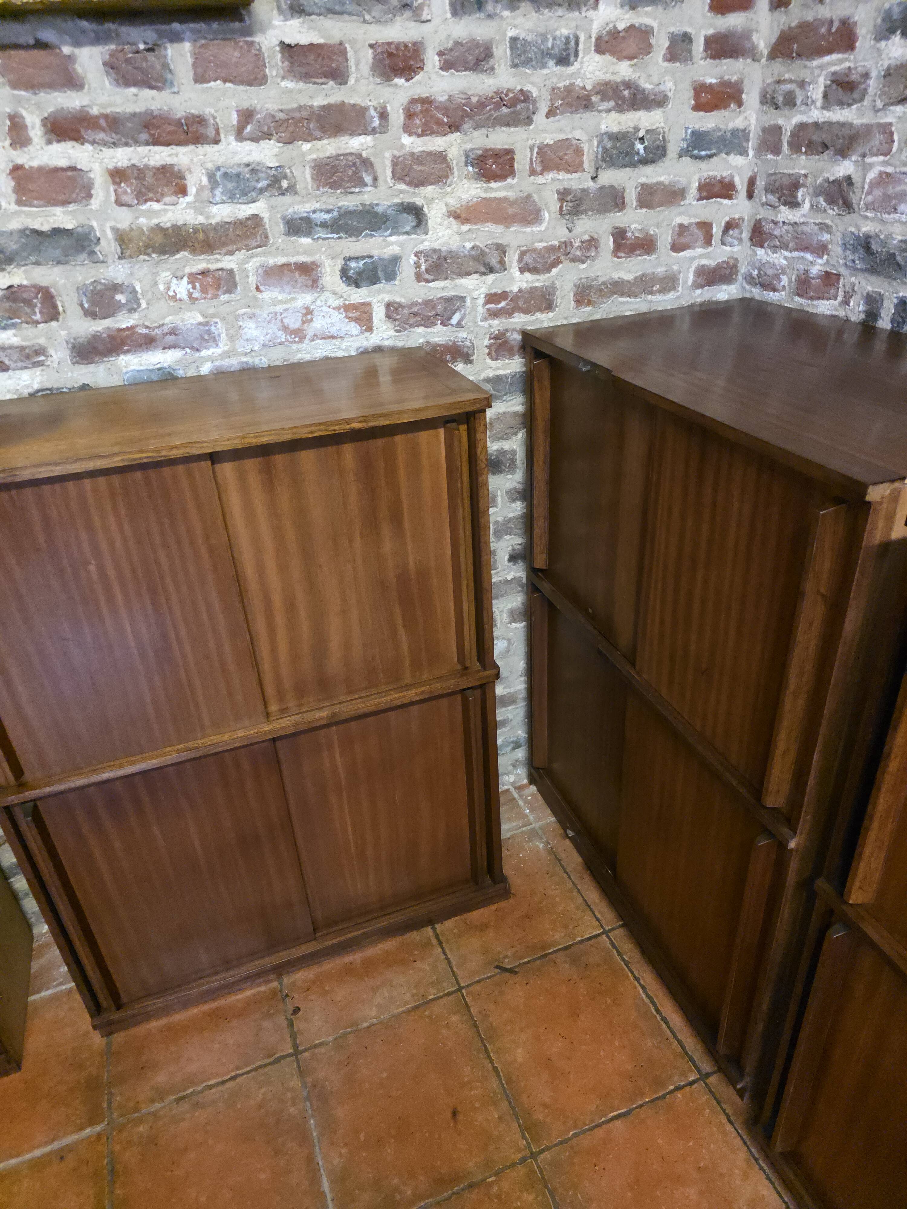 Modular corner library Oscar from the 1960s with sliding doors.