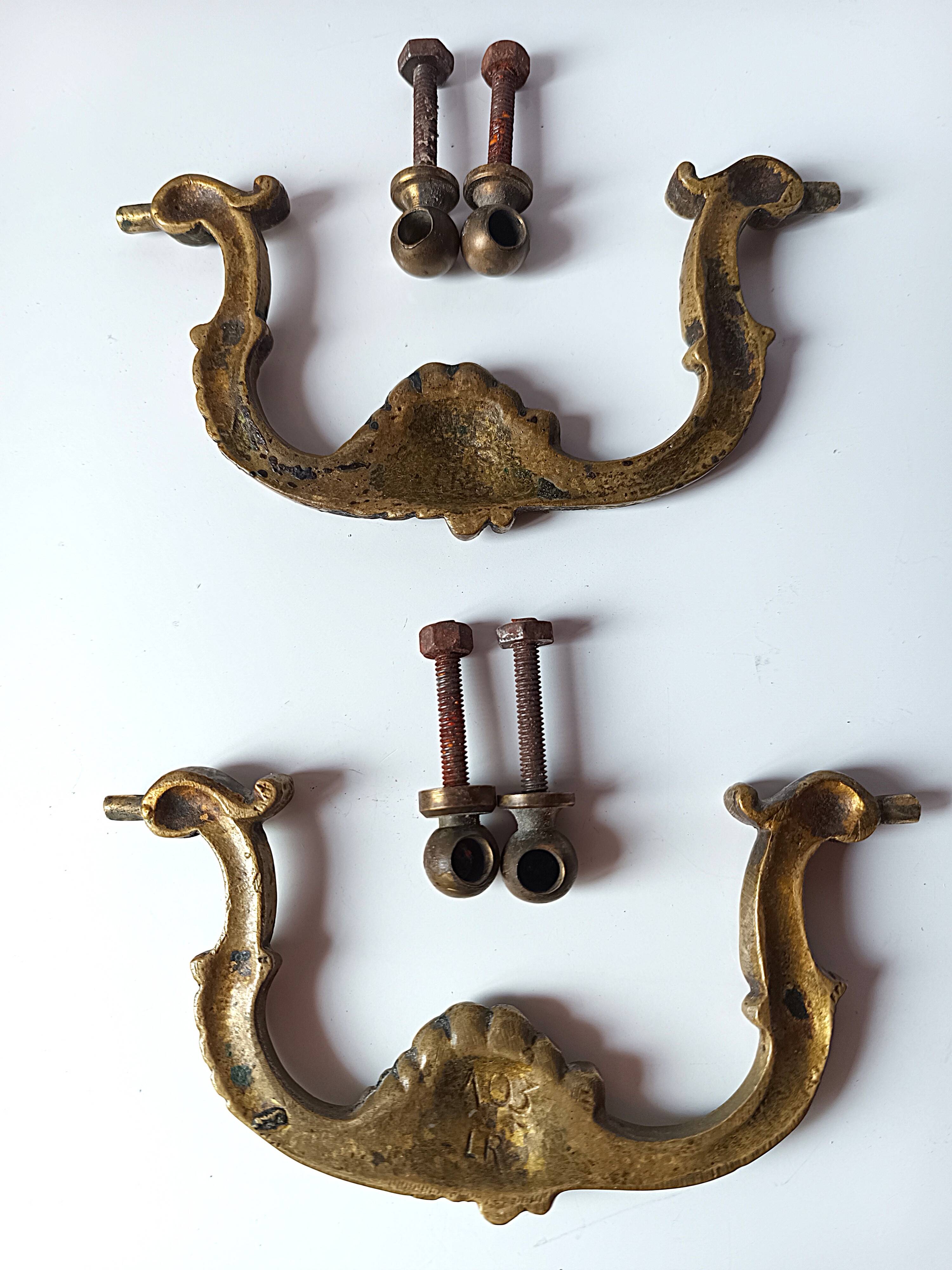 Antique pair of bronze drawer handles.