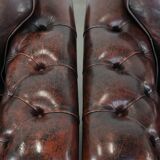 Set of two marbled cowhide leather Chesterfield armchairs in English style