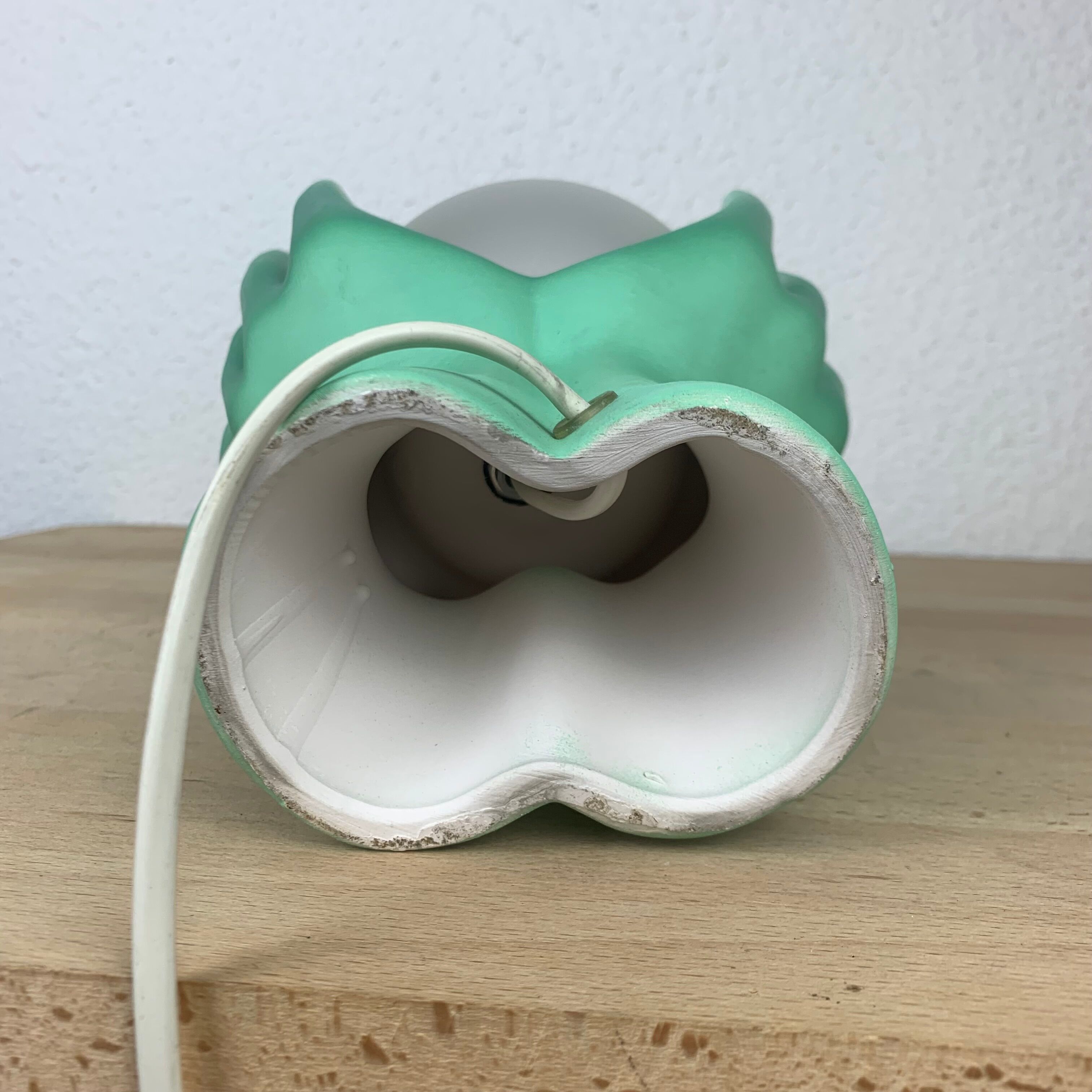 Green ceramic hand lamp and glass globe