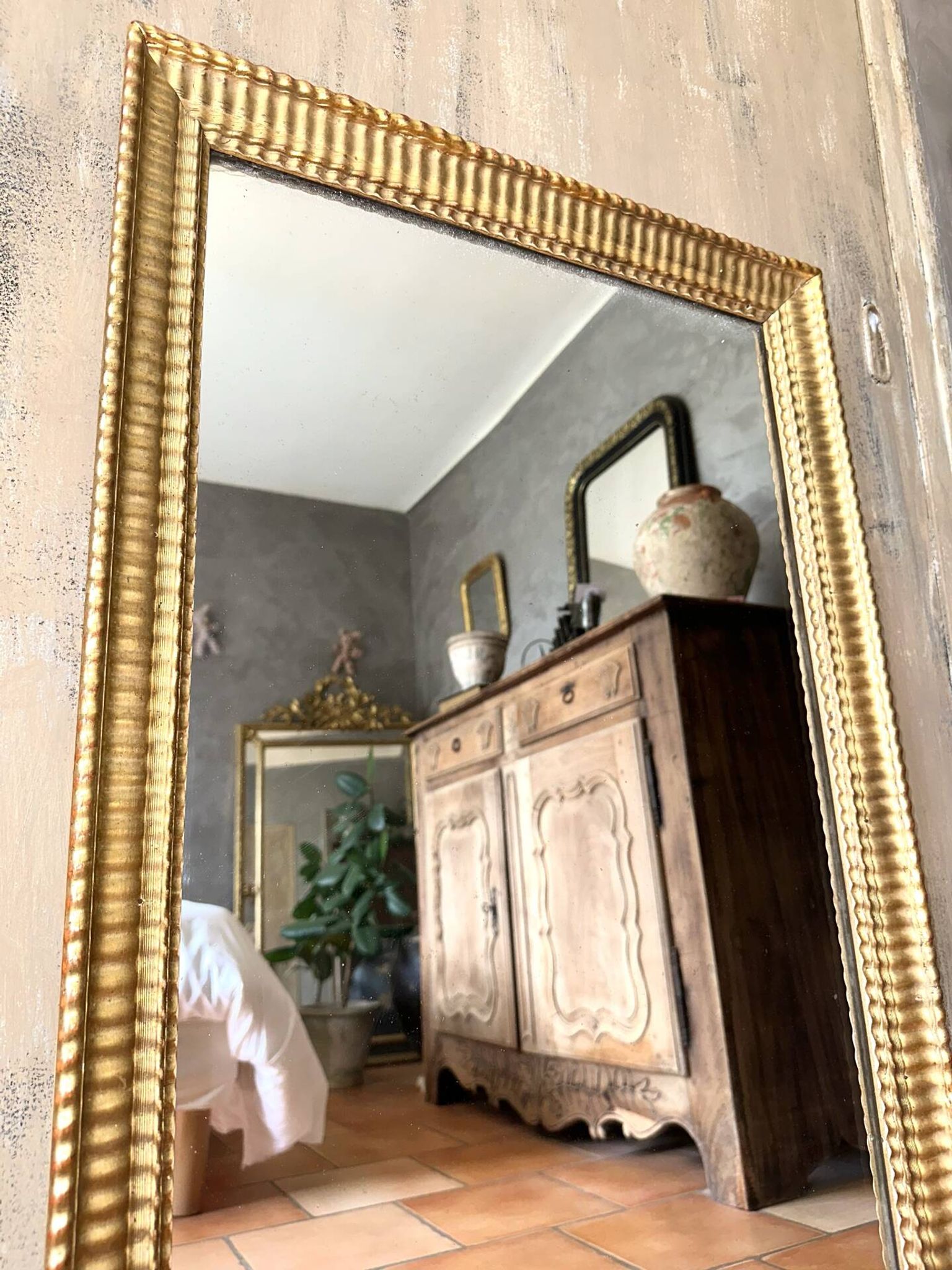 Antique Napoleon III gilded mirror from the 19th century.