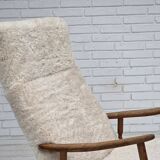 1970s, Danish rocking chair, reupholstered in quality genuine sheepskin.