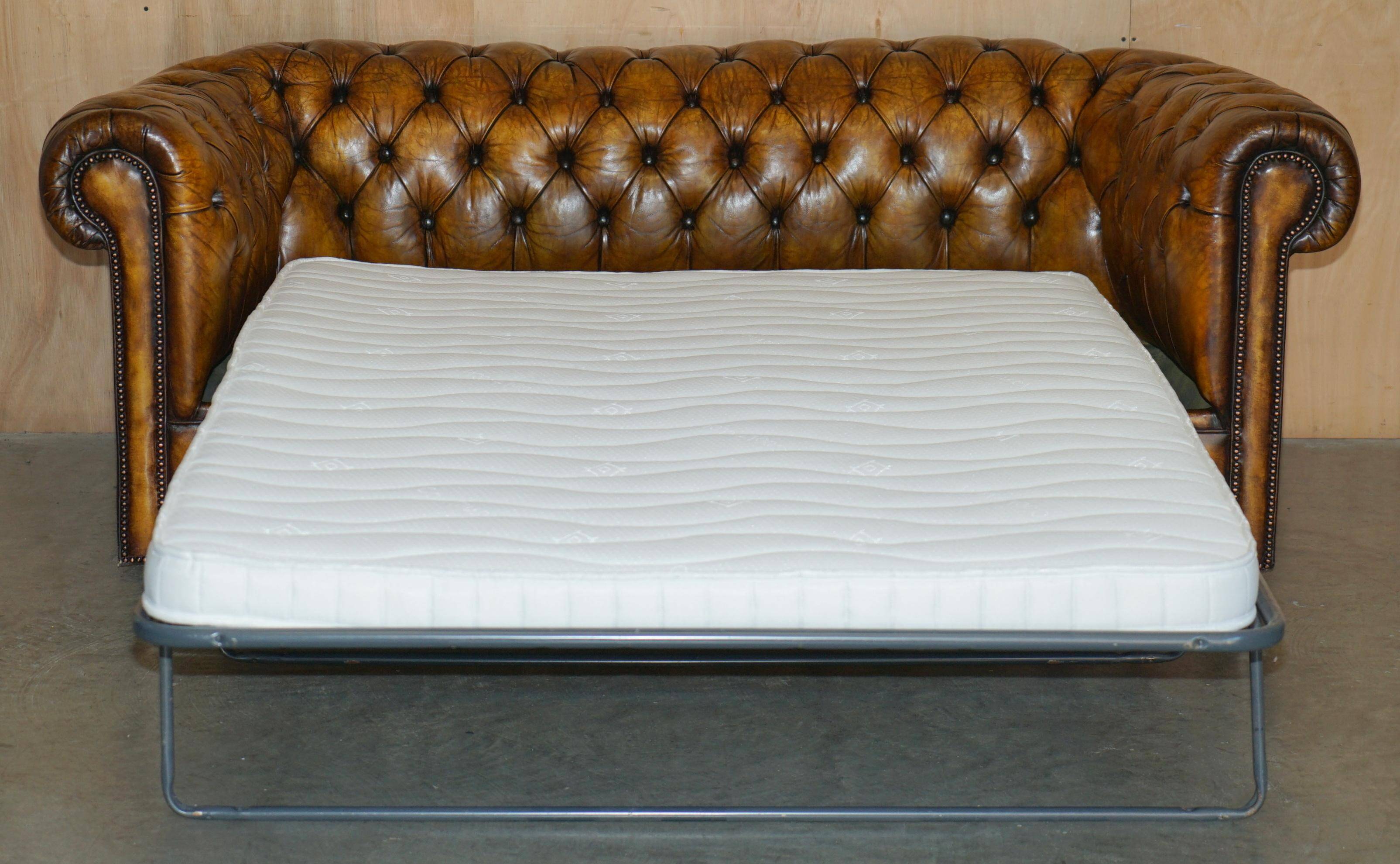 Vintage Chesterfield leather sofa bed, fully restored, circa 1940.