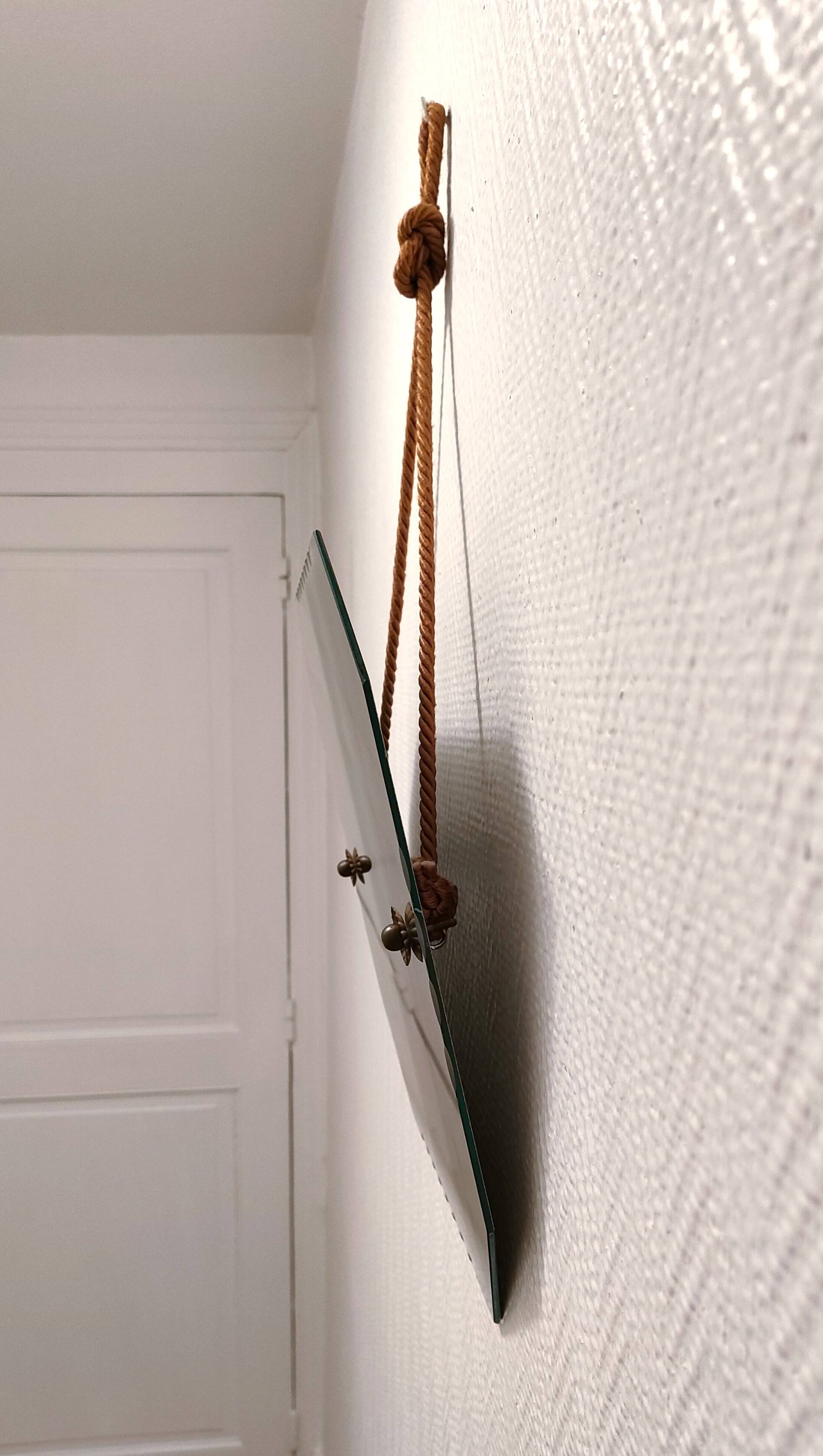 Octagonal mirror with brass hubcaps from the 60s