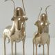 Two stylized zebu with long vintage brass horns