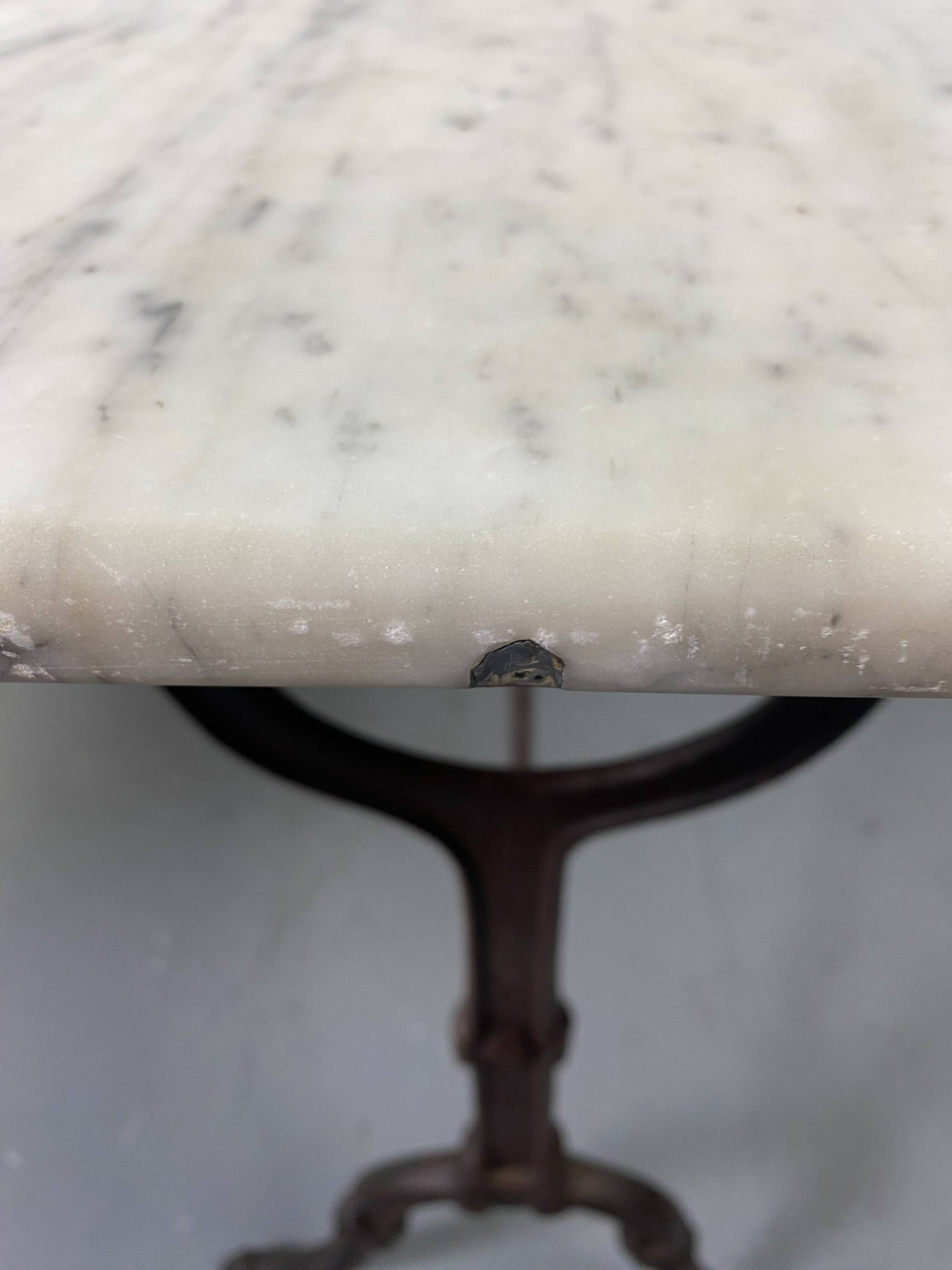 Set of two bistro tables in marble and wrought iron