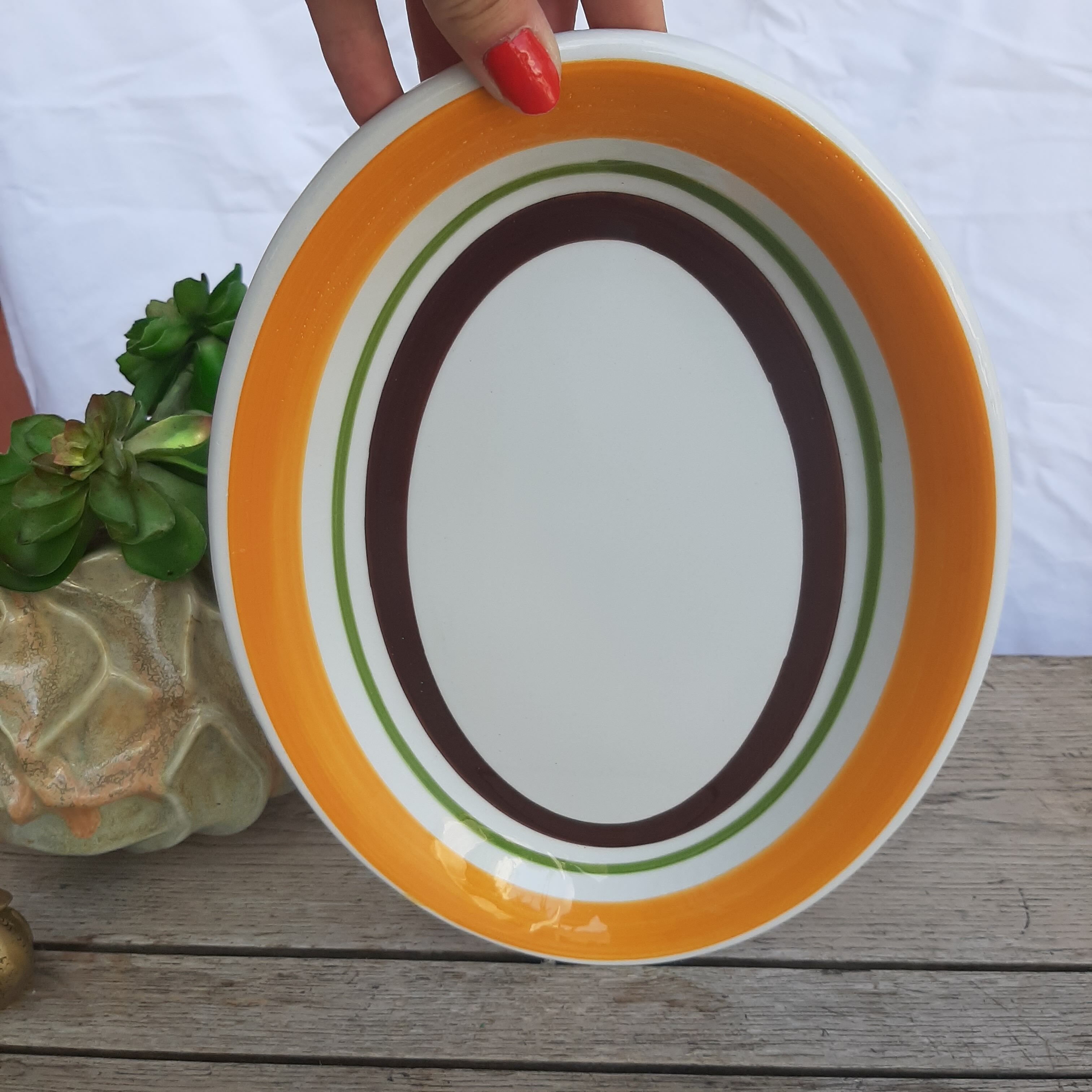 Orange and brown oval dish