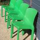 Set of 4 green Selene Magistretti chairs.