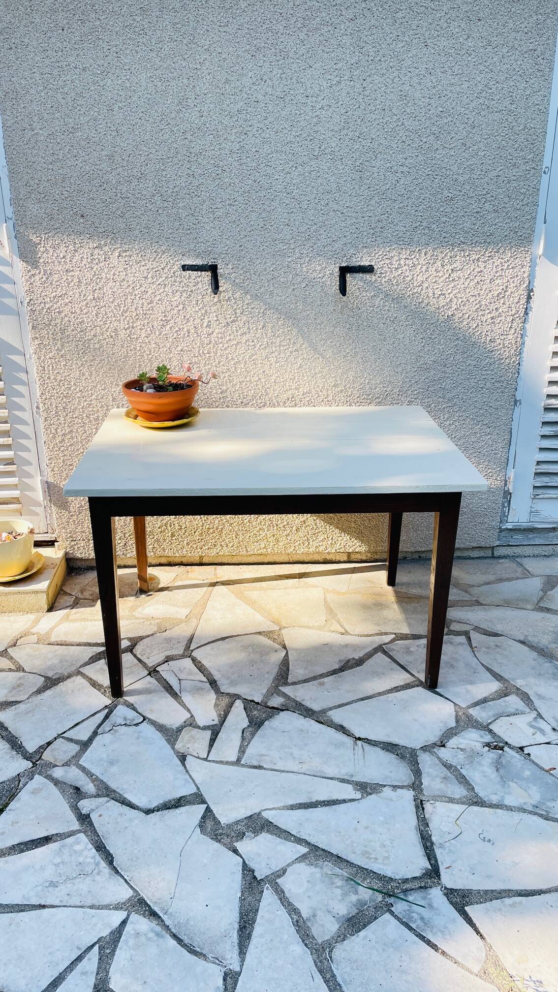 Vintage oak farmhouse table with a white top.
