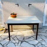 Vintage oak farmhouse table with a white top.
