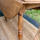 Round oak table with a drop leaf.