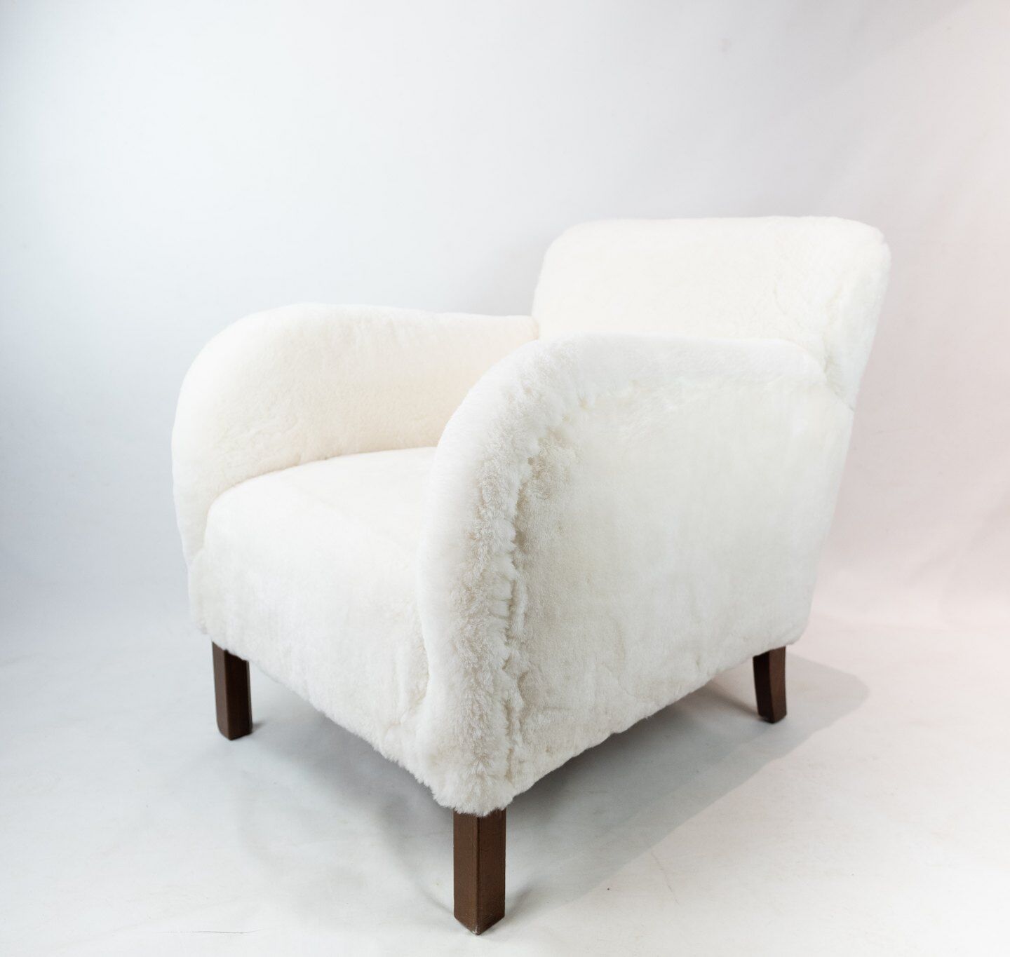 Easy chair newly upholstered with sheep wool and legs of polished wood by Fritz Hansen, 1930s