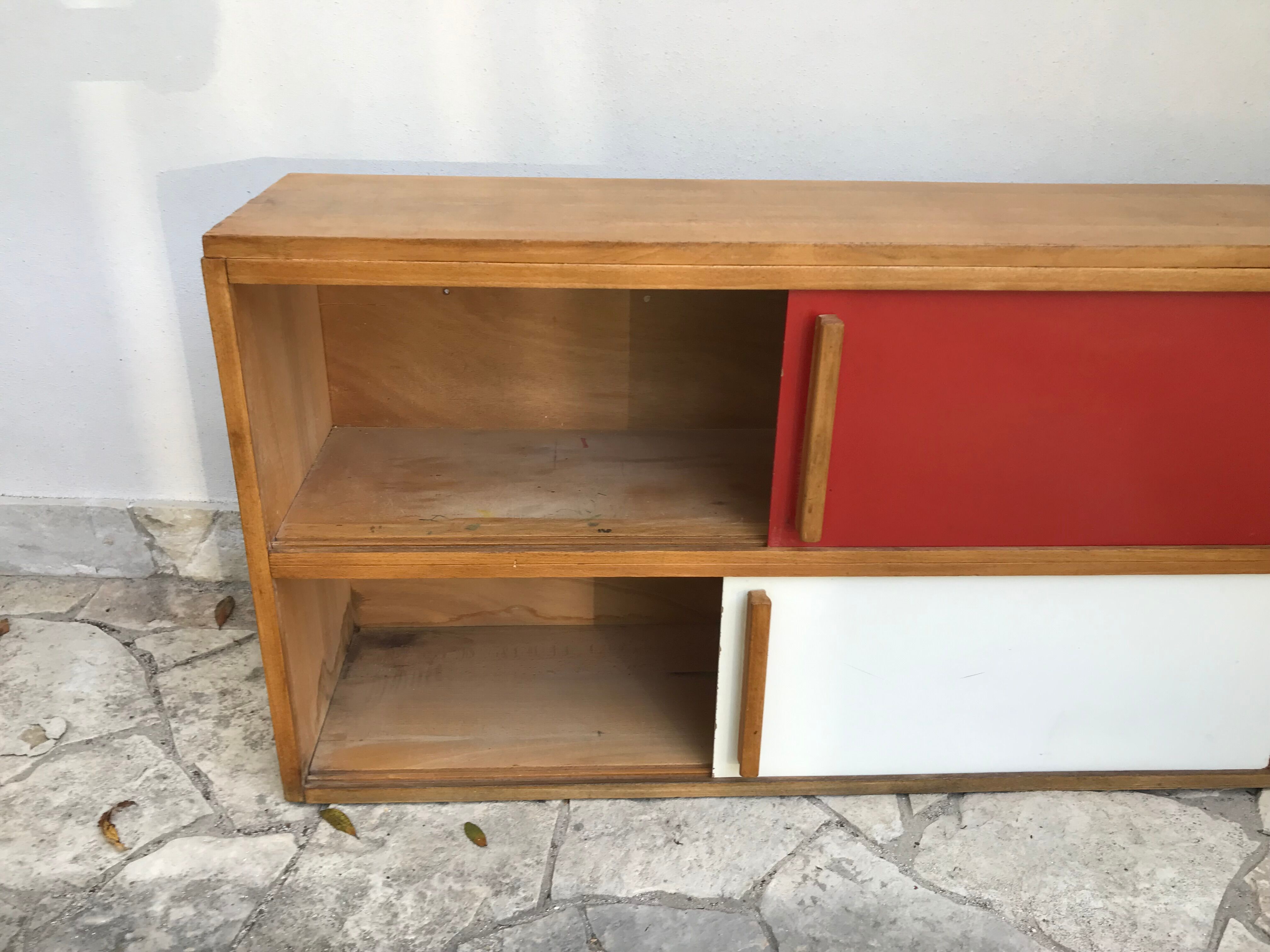 Storage cabinet with sliding doors circa 1950