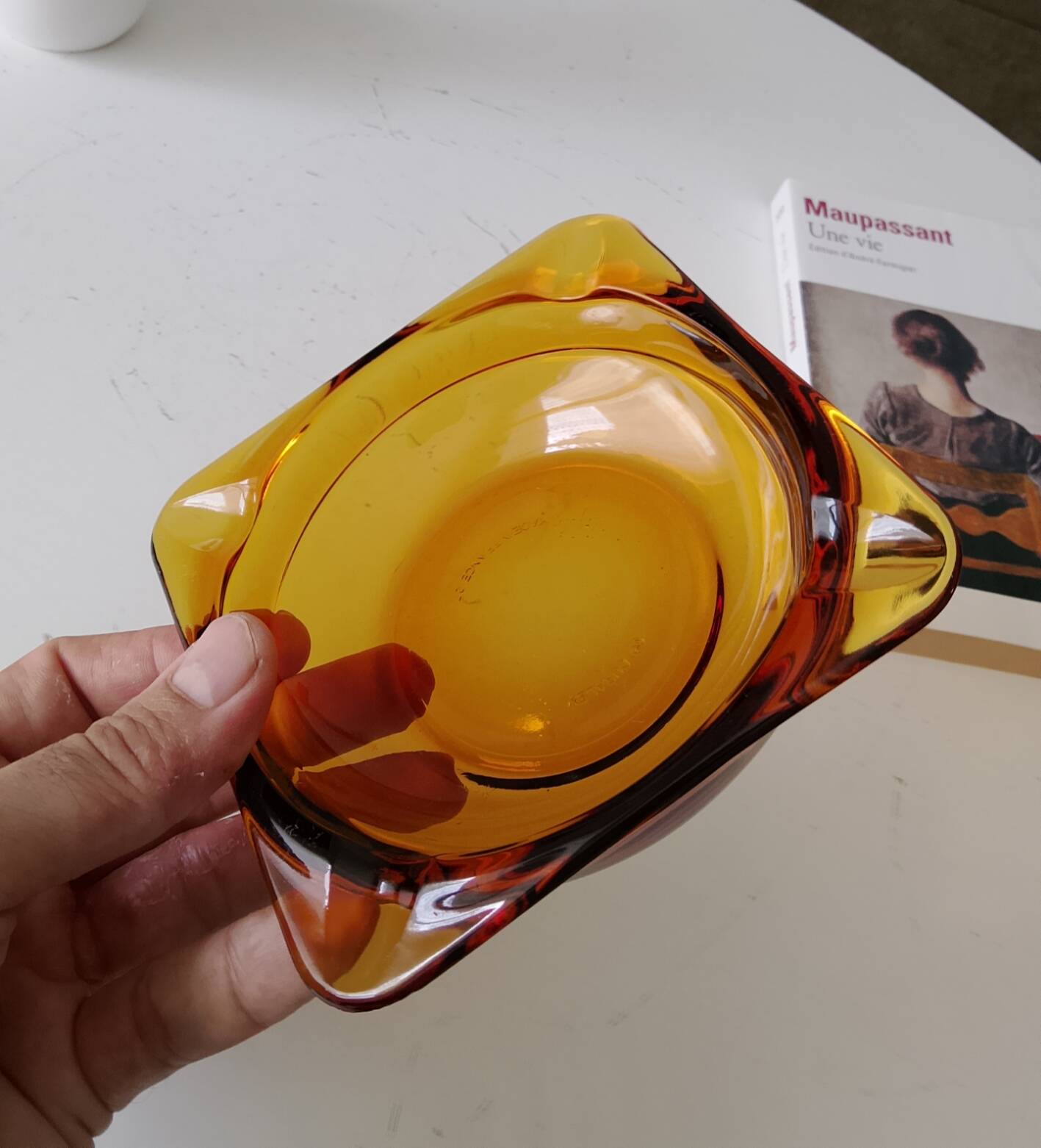 Vintage amber Duralex ashtray from the 1970s.