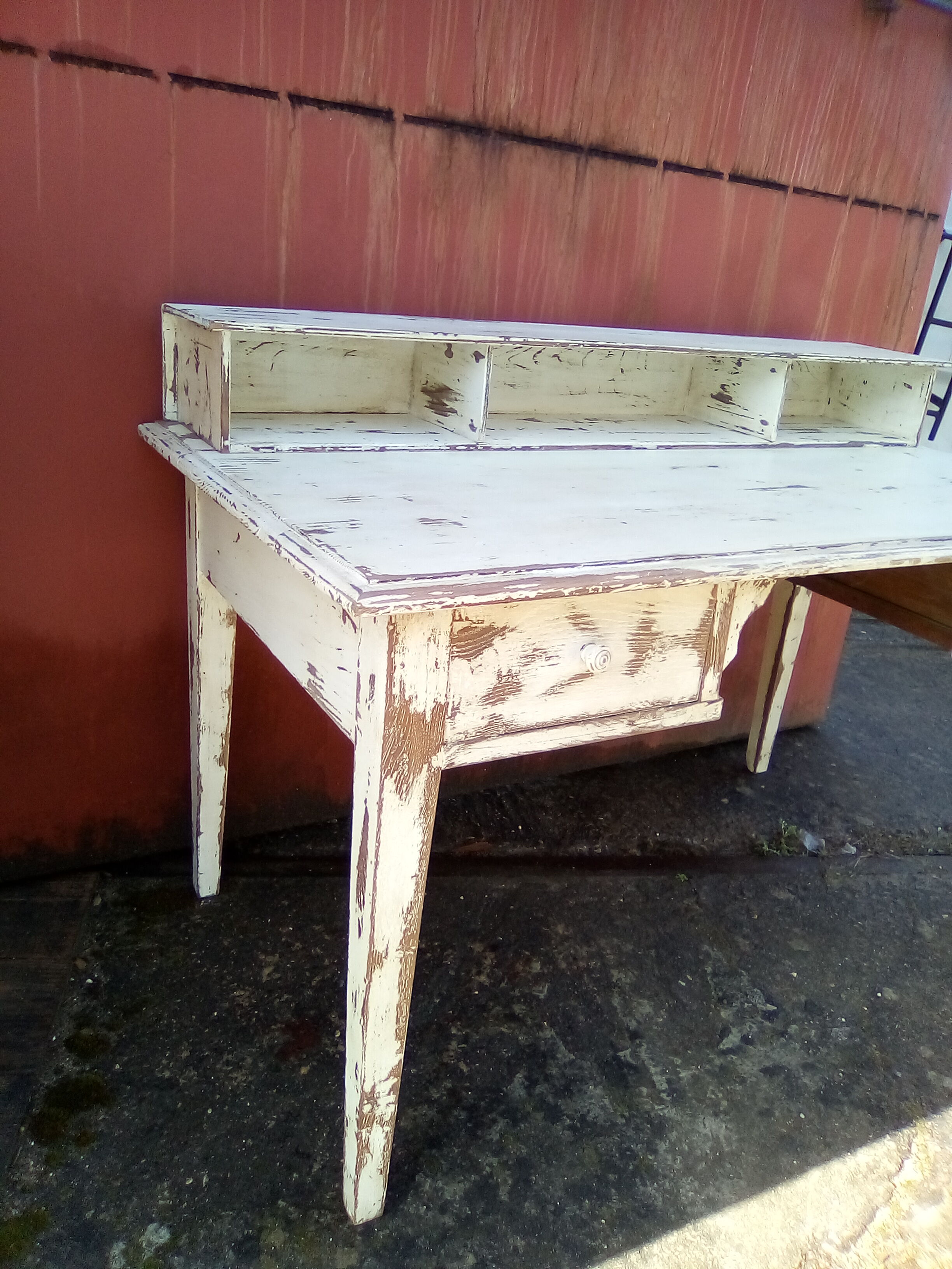 Large wooden desk with patinated bleacher