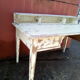 Large wooden desk with patinated bleacher