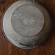 Round zinc basin planter with two handles underneath
