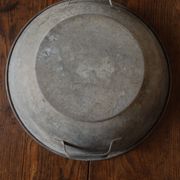 Round zinc basin planter with two handles underneath
