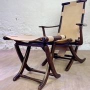 Colonial style leather armchair and ottoman