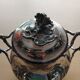 Teapot and sugar bowl in silver-plated metal.