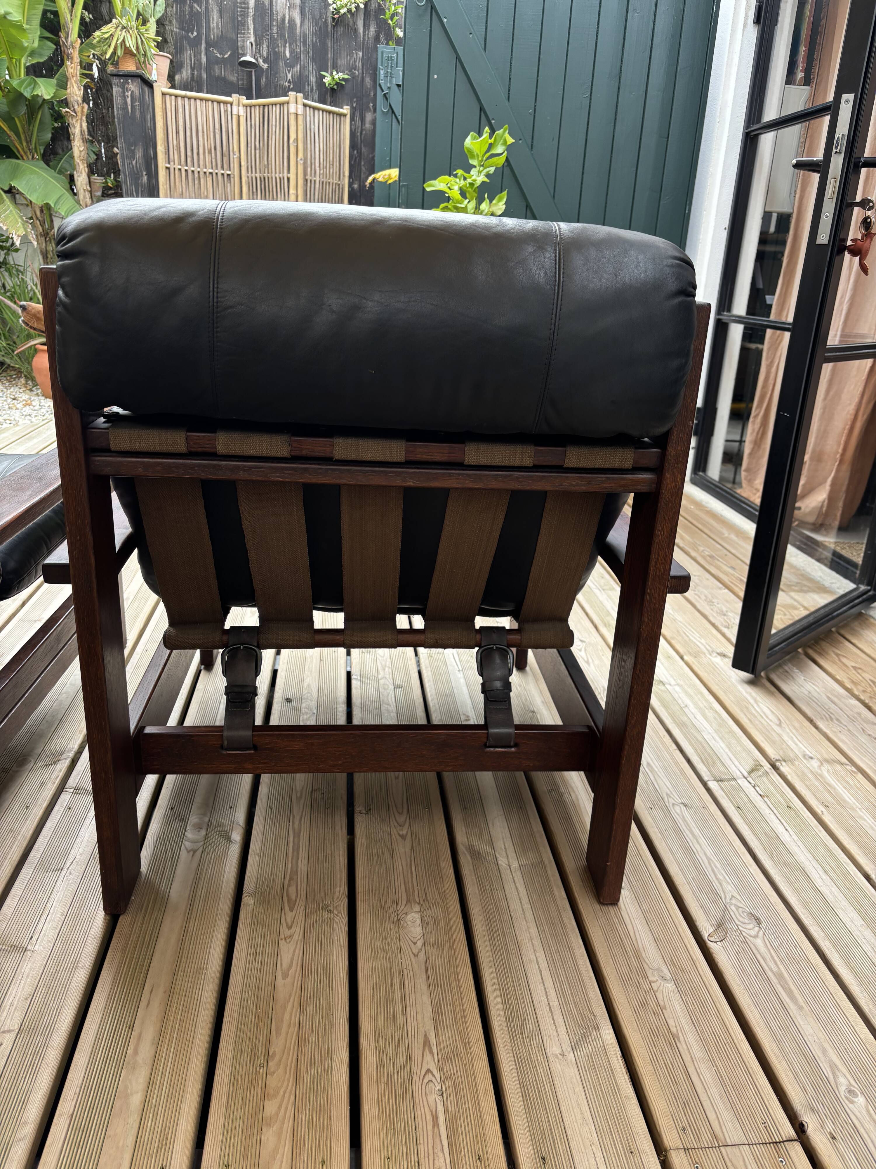 Vintage Scandinavian armchairs in leather and solid wood.