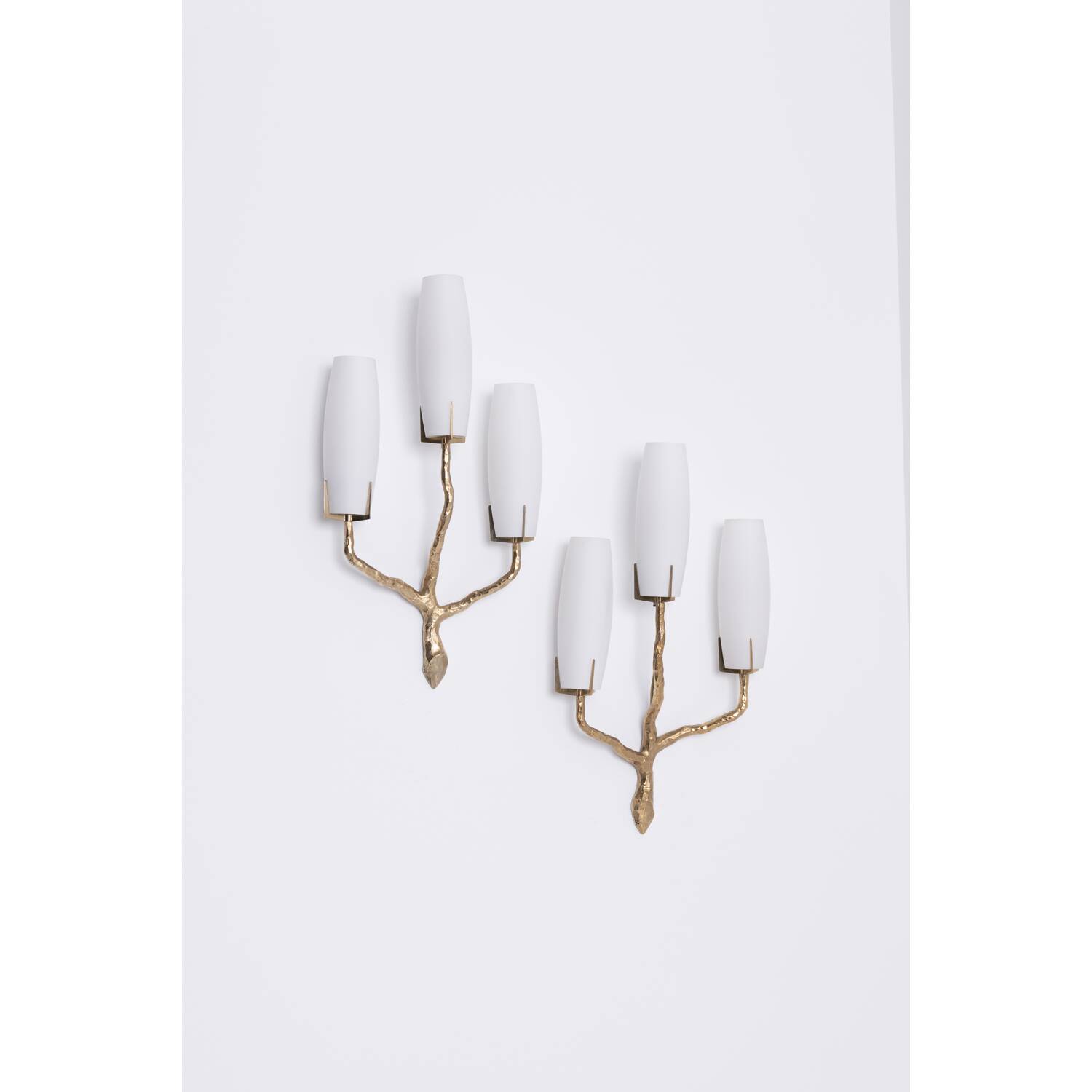 Pair of wall lights by Maison Arlus by Felix Agostini in bronze.