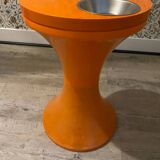 Orange tam-tam by Stamp with integrated pocket.